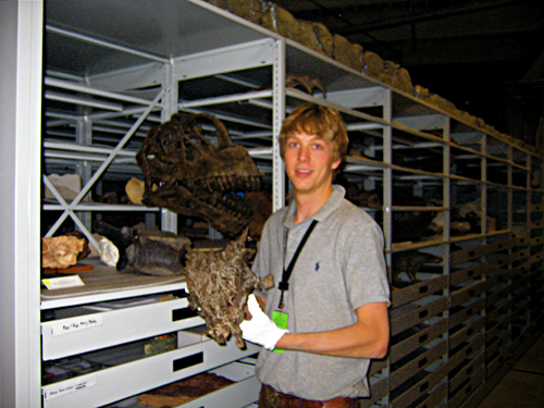 Photo of John holding the fossil skull of Dracorex hogwartsia