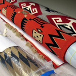 Image of Navajo rugs rolled up for storage