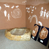 Photo of corn grinding and petroglyphs