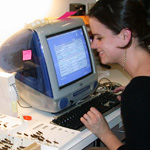 Thumbnail image of a student databasing grasshopper specimens in the entomology section