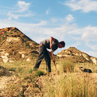 Photo of John Hankla in Wyoming, digging up fossils