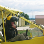Image of anthropologist in an Ultralight plane