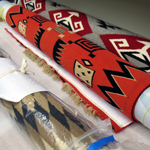 Image of Navajo rugs rolled for storage